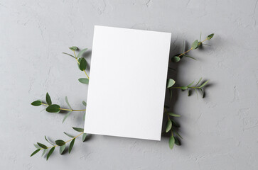Invitation, flyer or greeting card mockup with fresh eucalyptus twigs