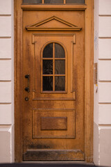 Obraz na płótnie Canvas Munich, Germany - May 01, 2022: Old Decorative Main Entrance Wooden Door.