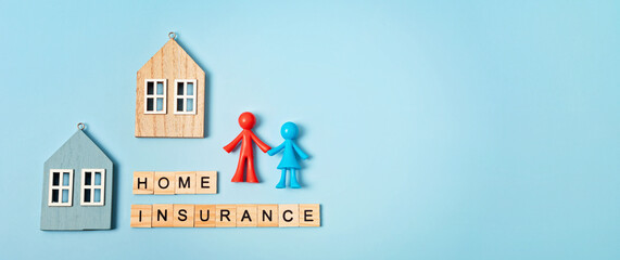 Home insurance message and wooden house over blue background. House insurance concept, residential home real estate protection. Top view, flatlay