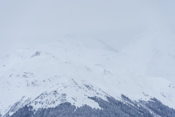 Fototapeta na wymiar Winter mountain landscape: The Rosa Khutor Alpine Resort near Krasnaya Polyana panoramic background.
