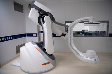 Angiographer machine in a modern hospital for heart surgery with a scaner and monitors.