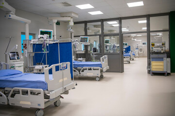 Empty Modern technology in intensive care unit room with different equipment and devices, beds and...