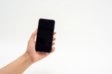 スマートフォンを持つ女性の手１