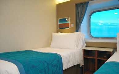 Oceanview outside exterior bedroom stateroom cabin suite in clean modern interior design onboard...
