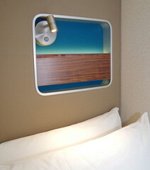 Oceanview outside exterior bedroom stateroom cabin suite in clean modern interior design onboard...