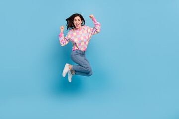 Full length photo of young excited lady jump up rejoice triumph ecstatic lottery fists hands...