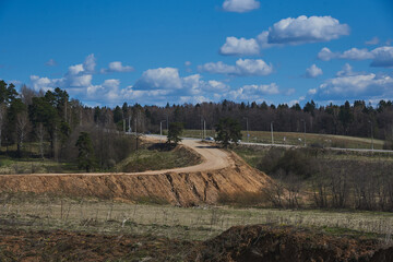 Sandy road leading to the quarry, through the forest.