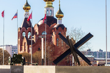 Czech hedgehog on the background of Orthodox church. Selective focus © Semiglass