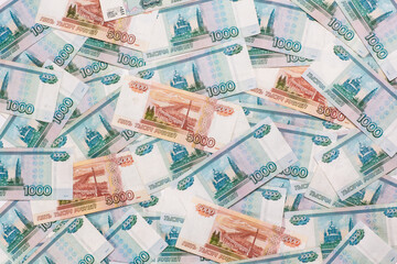 Russian money face value of one and five thousand rubles. Close-up of Russian rubles background and texture