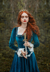 militant fantasy red-haired woman queen holding dagger in hands. Girl warlike princess warrior with...