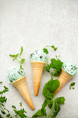 Organic Green Mint Chocolate Chip Ice Cream Scoops in Waffle Cones
