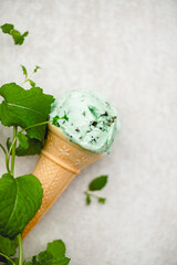 Organic Green Mint Chocolate Chip Ice Cream Scoops in Waffle Cones