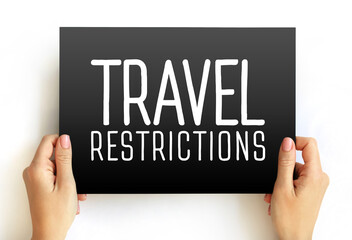 Travel Restrictions text concept on card for presentations and reports