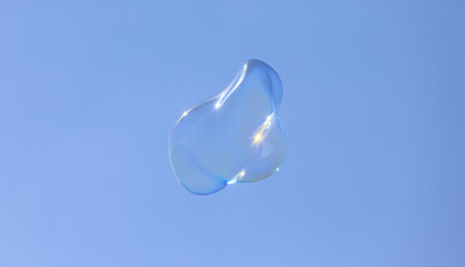 bubble blower on blue sky background