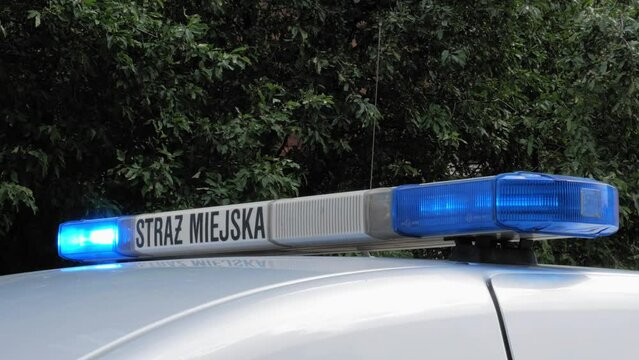 A Blue Flashing Beacon Of Municipal Police Car In Gdansk, Poland. - Closeup