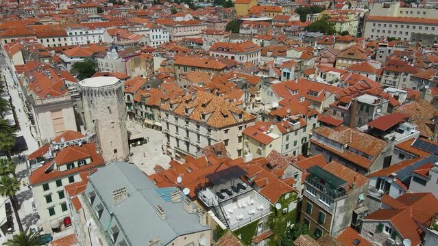Split, Croatia - : A cityscape picture of Split city centre showing Diocletian's Palace, the bell tower of the cathedral of St Domnius and Riva promenade during early evening