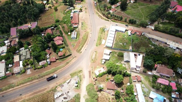 Aerial view of cars and people at a Open Air Market, in Africa - reverse, drone shot