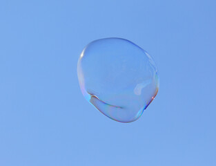 bubble blower on blue sky background