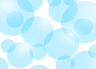 Light blue round translucent soap bubbles on a white background
