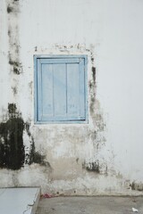 old window on cement wall