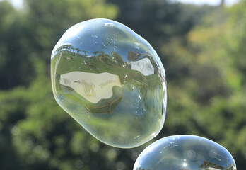bubble blower on blue sky background