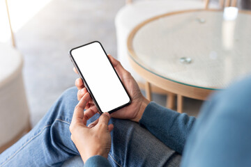 cell phone blank white screen mockup.hand holding texting using mobile on desk at office.background empty space for advertise.work people contact marketing business,technology