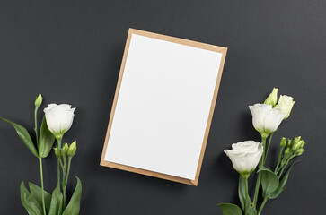 Invitation card mockup with envelope and white eustoma flowers