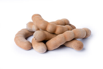Pile of Tamarind fruit (Tamarindus) isolated on white backgrund. 