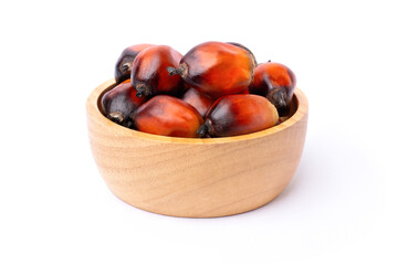 Oil palm fruit in wooden bowl isolated on white background. 