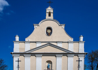 General view and close-up of architectural details of the sacred complex built in 1791, i.e. the belfry and the Catholic church of Saint John the Baptist in the town of Piski in Masovia in Poland.
