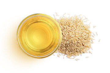 Rice bran oil extract with brown rice isolated on white background. Top view. Flat lay.
