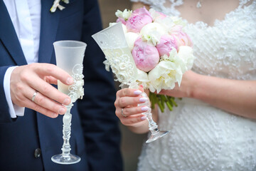 Bride and Groom Toasting with Champagne on Wedding Day. close-up of newly married for wedding...