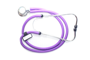 medical stethoscope purple color, on a white background