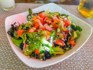 Plate of salad in restaurant PapaCharly Playa del Carmen Mexico.