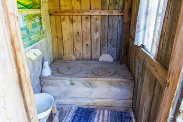 Picturesque old outhouse in old-fashioned style