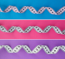 Collage of white centimeter on the colored  background.Top view. Copy space.