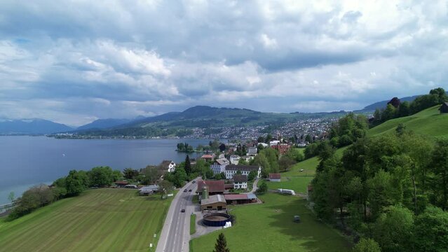 Drone rise and establish to wonderful town Richterswil on the lake Zurich