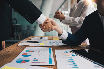Business people shaking hands, finishing up meeting, business etiquette, congratulation, merger and...