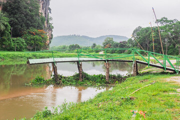 A wooden bridge that collapsed due to the violent flooding.