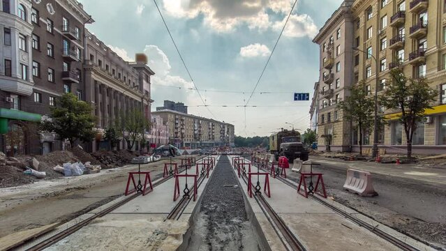 Tram rails at the final stage of their installation and integration into concrete plates on the road timelapse. Filling by liquid resin for reduction from vibration and noice. The process of