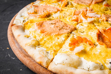 hot delicious traditional italian pizza on a dark stone background