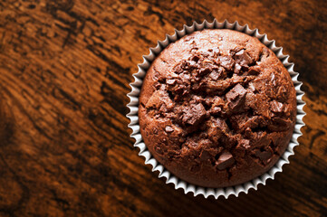 Chocolate muffin on wooden table