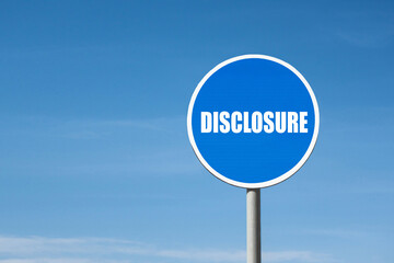 'Disclosure' sign in blue round frame. Clear sky is on background