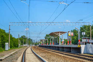 Fototapeta na wymiar Panorama of the railway station for urban electric trains. Translation of the inscription on the signs: 