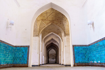 Arch gallery with vaulted ceilings in the structure of the Kalyan Mosque in Bukhara, Uzbekistan