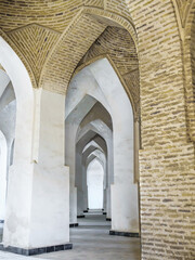 Interweaving of arched passageways with vaulted ceilings in the design of the Kalyan Mosque in Bukhara, Uzbekistan