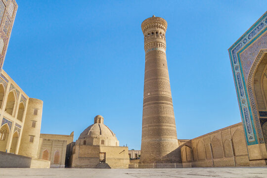 Central square in front of the Kalyan minaret - the symbol of the city of Bukhara, Uzbekistan. On the right is the Kalyan mosque, on the left is the Miri-Arab madrasah