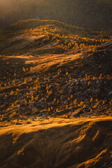 Autumn in the Italian Dolomites. The most beautiful time of the year to visit this place. Beautiful colors and breathtaking views. Mountain peaks above the valleys.