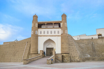 View of the main entrance to the ancient citadel Ark in Bukhara, Uzbekistan. Walls of the old...