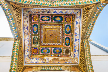 Decorations on the ceiling of the entrance part of the harem building. Shot at the former emir's summer residence Sitorai Mohi Xosa in Bukhara, Uzbekistan - obrazy, fototapety, plakaty